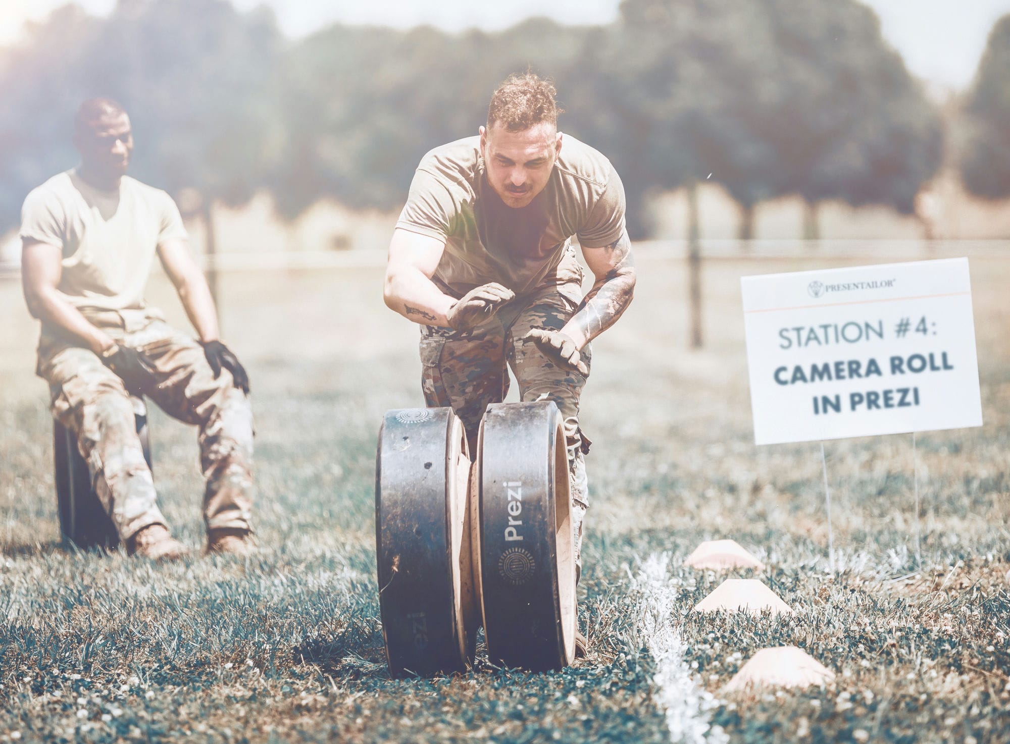 Soldier on training ground rolling a wheel